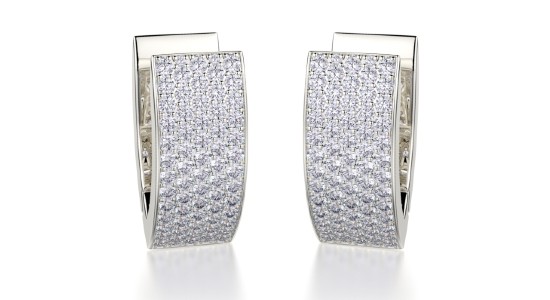 a white gold pair of diamond studded huggies earrings