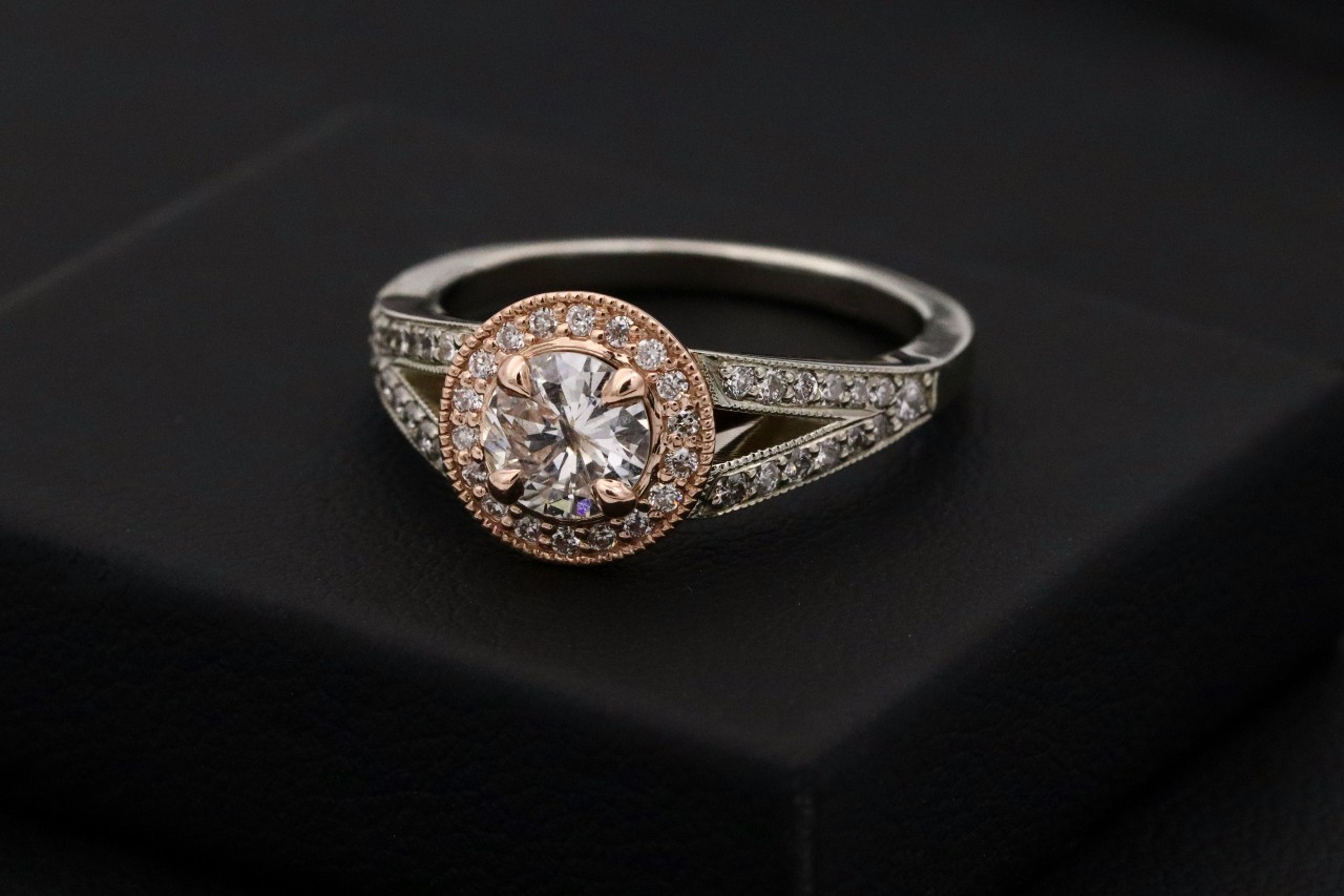 a customized engagement ring on a black background