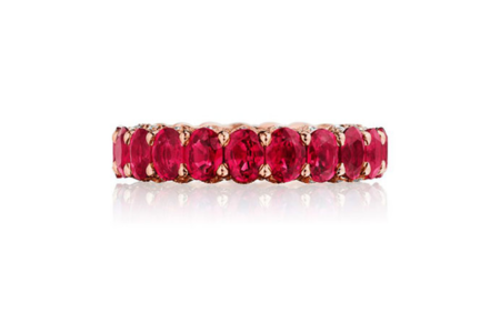 A vibrant ruby and rose gold wedding band from TACORI, available at The Wedding Ring Shop.