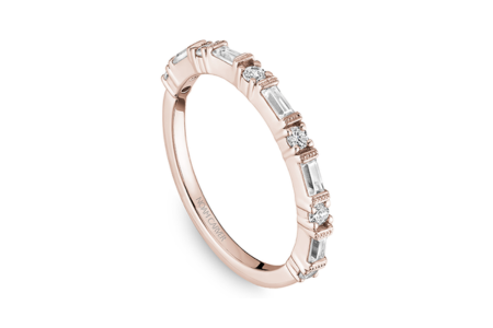 A delicate diamond and rose gold wedding band from Noam Carver, available at The Wedding Ring Shop.