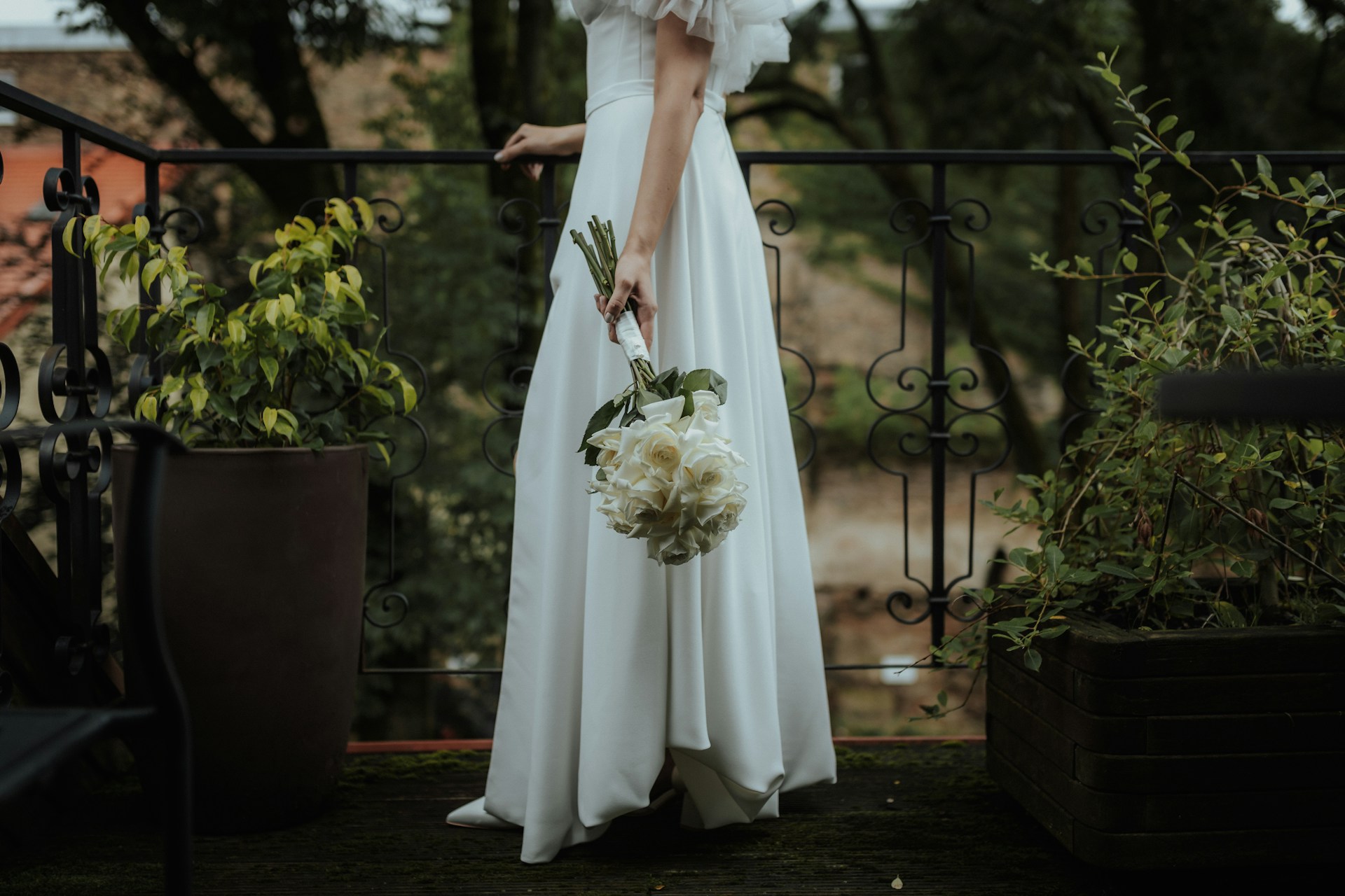 a bride holding a bouquet of flowers